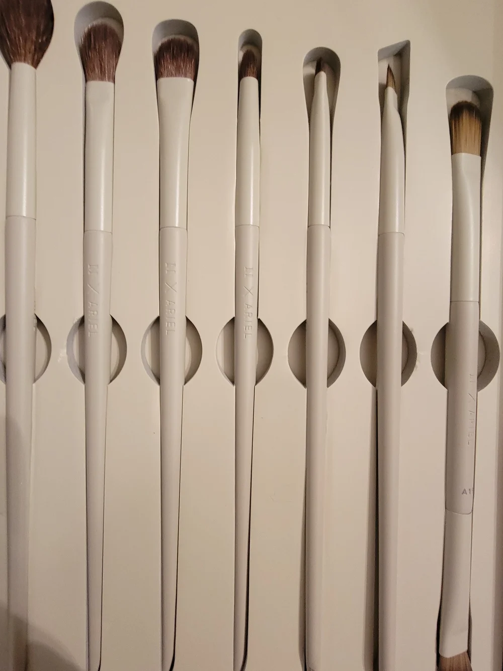 A Box Full Of Many High End Facial Items & Women's 8 Piece White Makeup Brushes